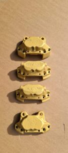 Cerakote brake calipers in Gold V-167, caliper coating by Slamfire Tactical Coatings near Wellingborough, Northamptonshire