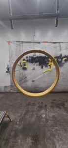 Gold motorcycle wheel rim Cerakoted in Gold H-122 by Slamfire Tactical Coatings, Northamptonshire