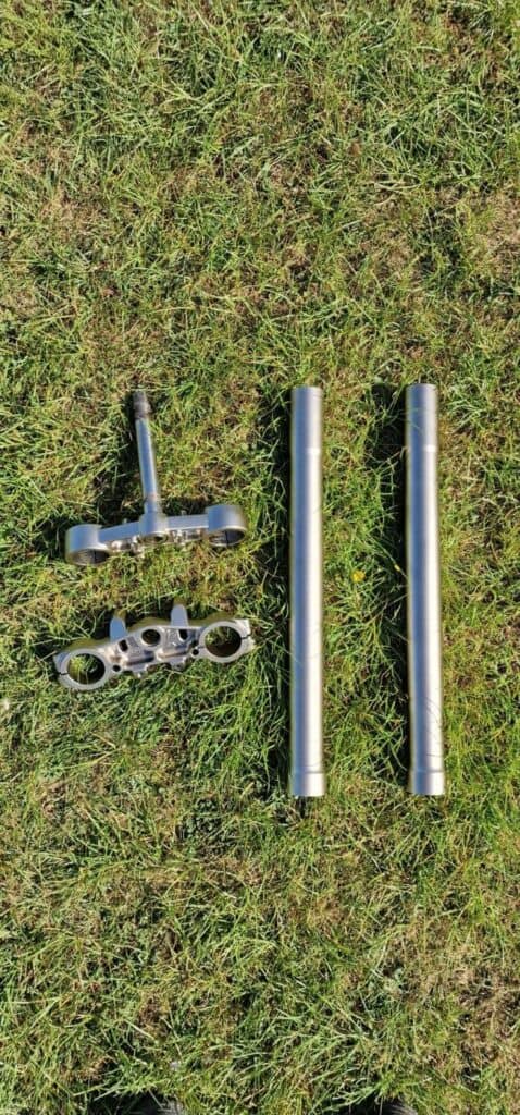 Motorcycle triple clamps and fork tubes Cerakoted in FX-114 Champagne by Slamfire Tactical Coatings near Wellingborough